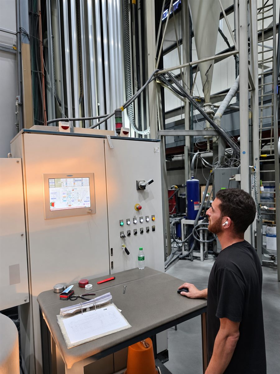 Team-Chen operator monitoring the automated powder coating line control station
